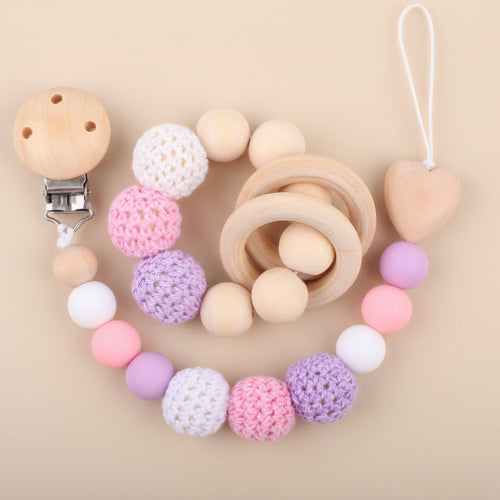 attache tetine hochet bois crochet rose