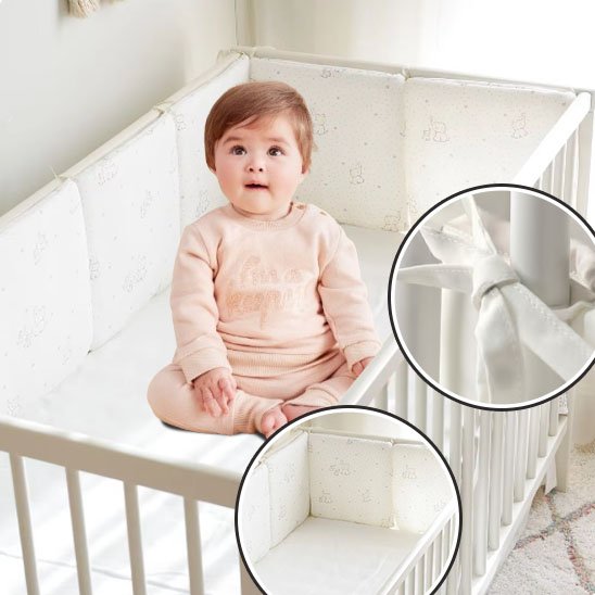 Tour de lit bébé fixation