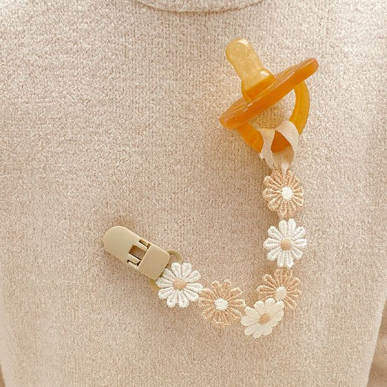 Attache tetine attirant 